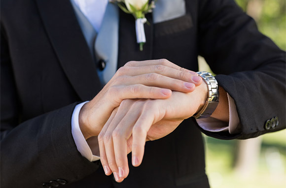 Photo: Groom Checking Time via Shutterstock