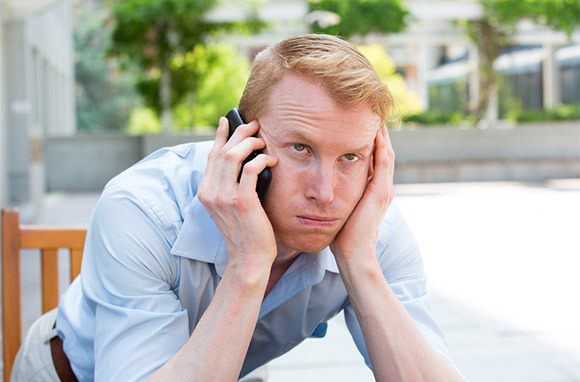 Photo: Frustrated Man on the Phone via Shutterstock