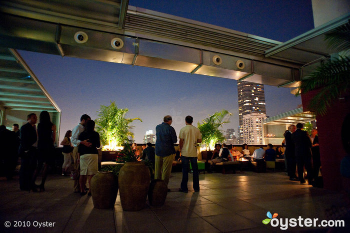 The Empire Hotel's rooftop features a bar, a pool and an old-fashioned neon sign.