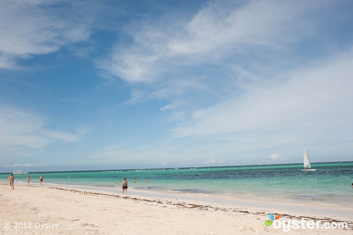 The white-sand beach at the Now Larimar provides the perfect setting for a casual wedding.