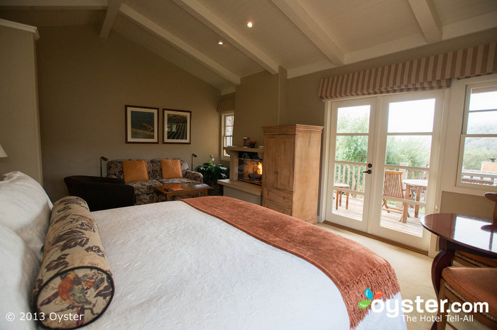 Luxurious rooms feature stone fireplaces, private decks, and comfortable beds.