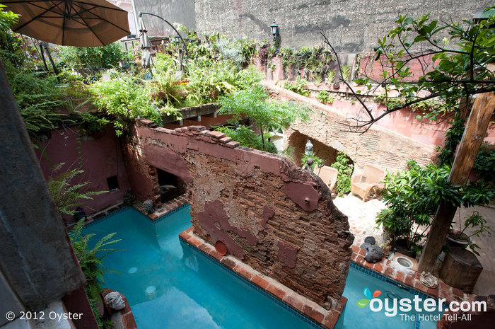 The pool meanders through a set of ancient walls that still stand on this historic property.