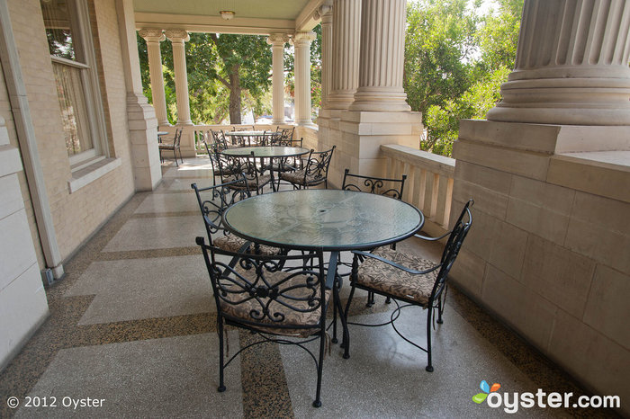 Outdoor seating on the veranda is a lovely spot for photos or a moment alone for the bride and groom on the big day. 