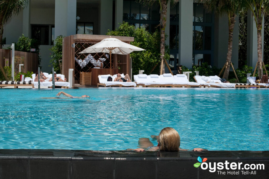 Guests relaxing at the pool at the W South Beach. Guests relaxing at the pool at the W South Beach.