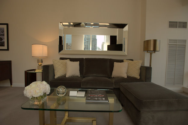 Living areas feature mirrors and silver, gold and bronze accents.