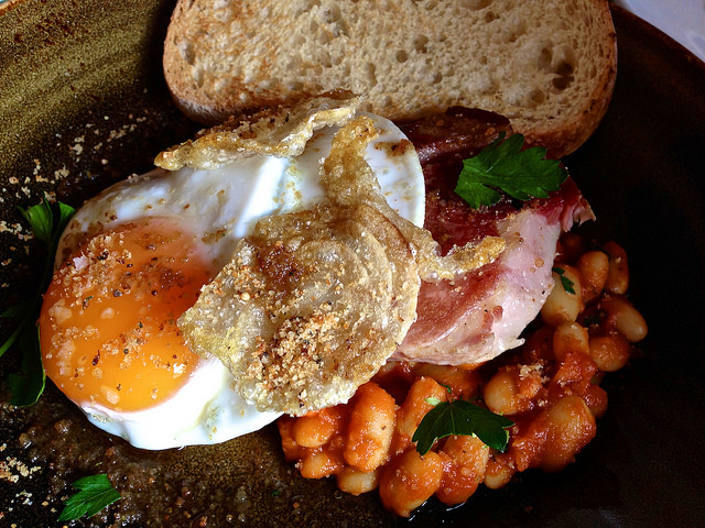 Smoked pork neck with braised beans, fried duck egg and toast at St Ali in South Melbourne. Photo Credit: Katherine Lim, Flickr