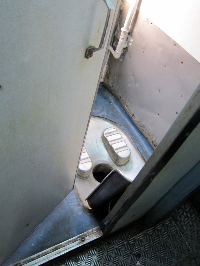 Sneak peak of a train bathroom; Image courtesy of Indi Samarajiva via Flickr.