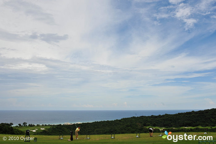 Players use the driving range at The Ritz-Carlton Golf & Spa Resort, Rose Hall's White Witch course