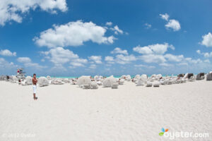 Is it normal that the lounge chairs match the clouds (and that guy's bathing suit)?