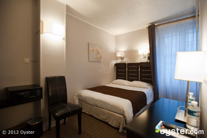 Rooms have contemporary furnishings, flat-screen TVs, and modern bathrooms.