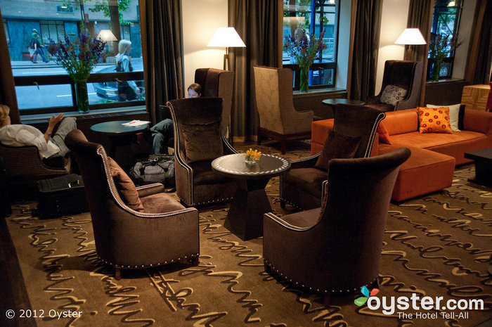 The lobby has plenty of seating for people to meet with friends and check their email.
