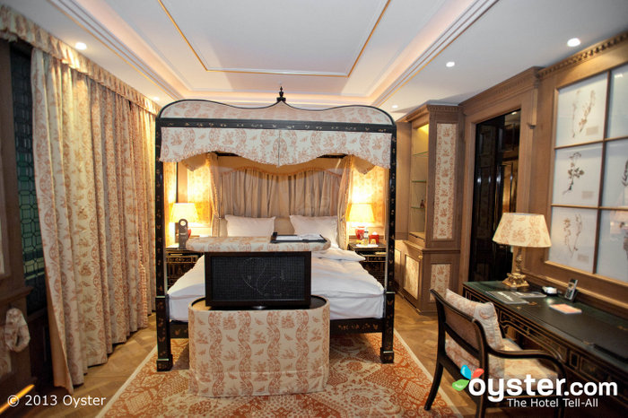 Luxurious rooms feature four-poster canopy beds and fresh cut roses.