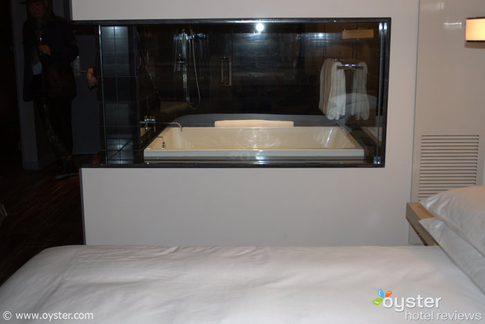 Peek-a-boo! In many rooms a glass window provides a view from the bathtub into the guestroom.