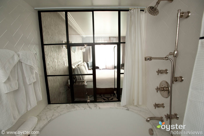 Some peek-a-boo bathrooms, like this one at the Shangri La Santa Monica, let modest guests hide behind a curtain.