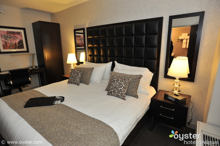 The queen bed in a standard room. The rooms will feature 37-inch flat-screens, iHome iPod docks, Frette bathrobes, and free high-speed Wi-Fi.