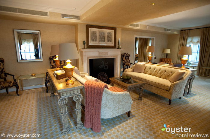 Two fireplaces and large windows brighten the sitting room in the St. Regis Washington D.C.'s Presidential Suite.
