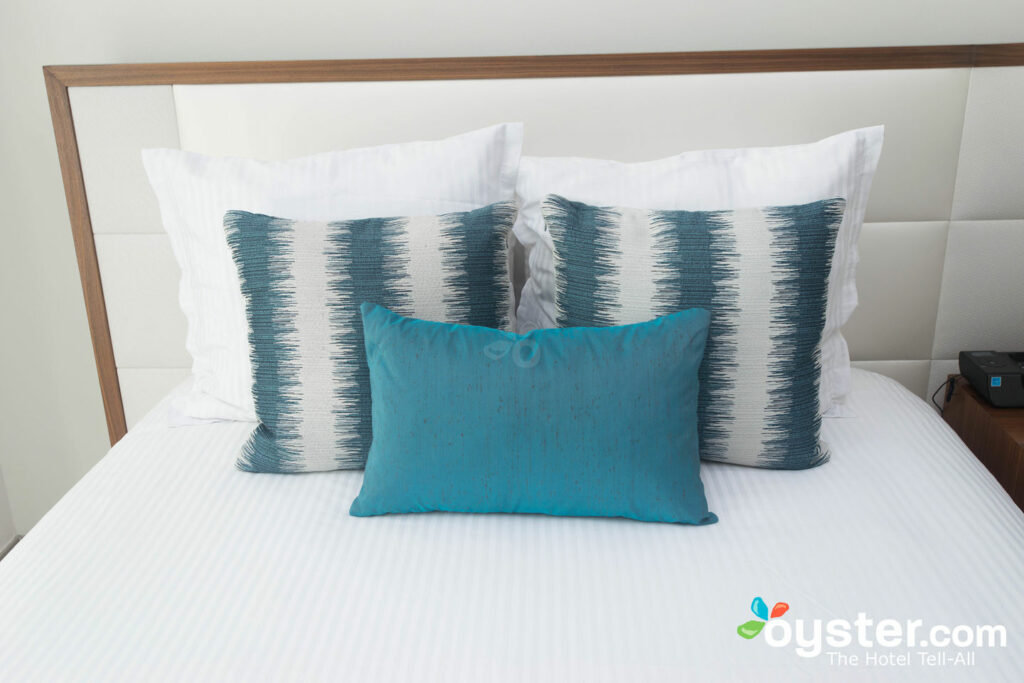 A bed at the Secrets the Vine Cancun Resort and Spa. A bed at the Secrets the Vine Cancun Resort and Spa.