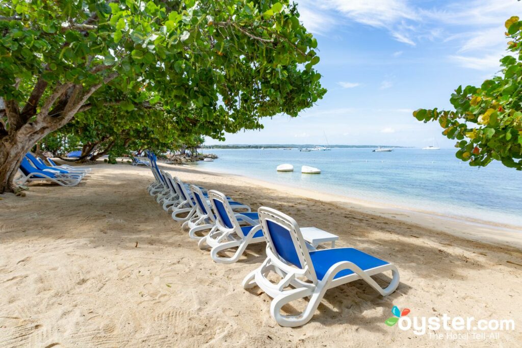 Cute couple is having a rest on the beach naked