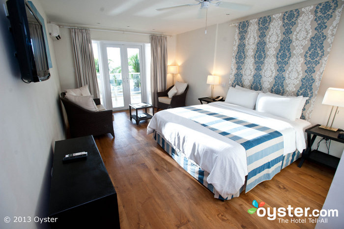 Spacious rooms feature simple but stylish modern decor in beach-y colors.