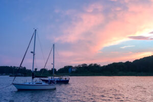 Sunset on the water with boats in Bristol, Rhode Island