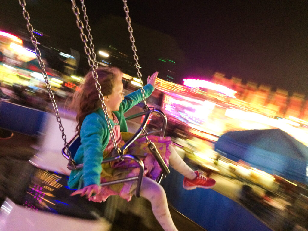 Girl on swing at the North Carolina State Fair