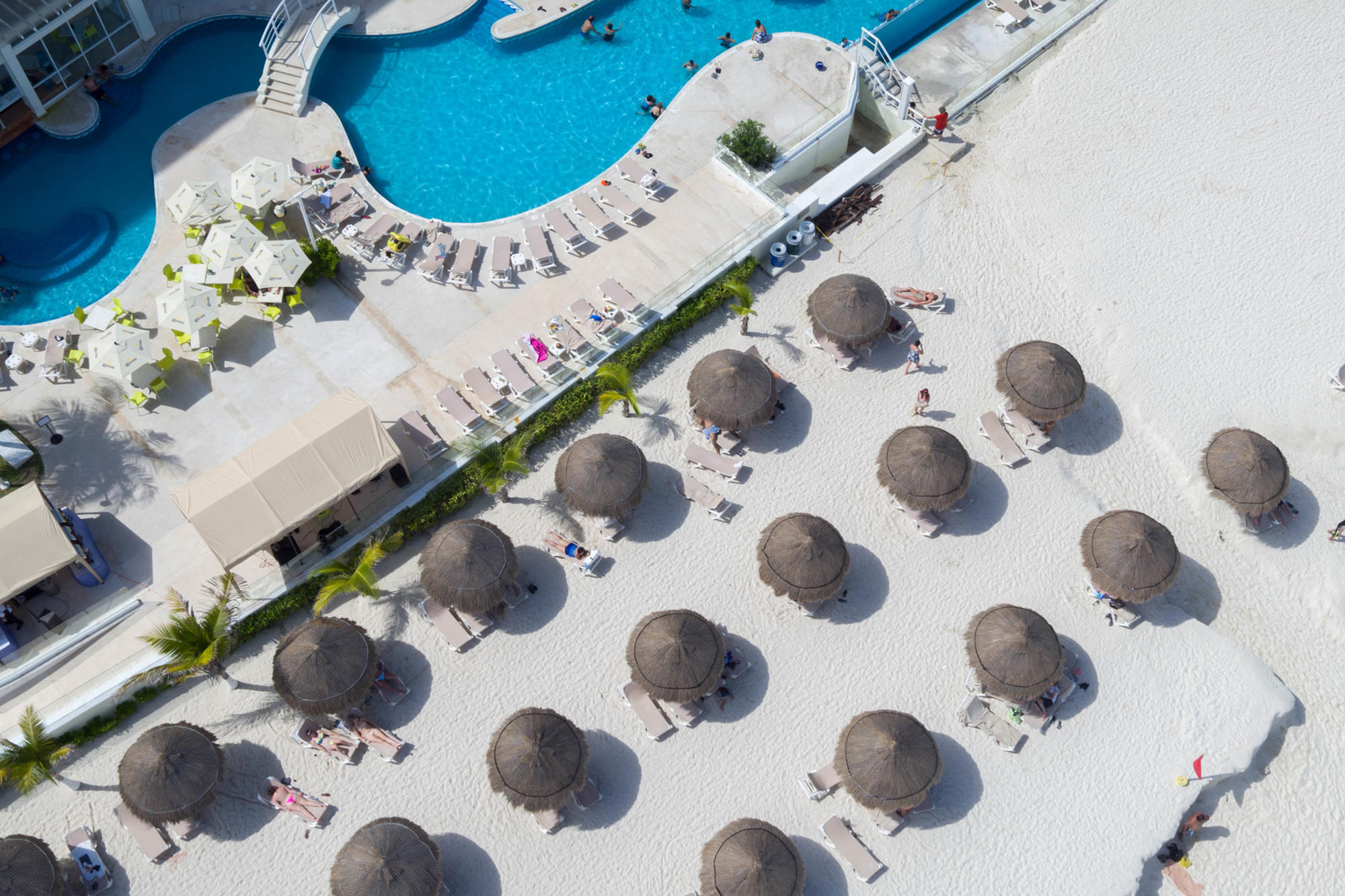 The pool and white-sand beach at Krystal Cancun