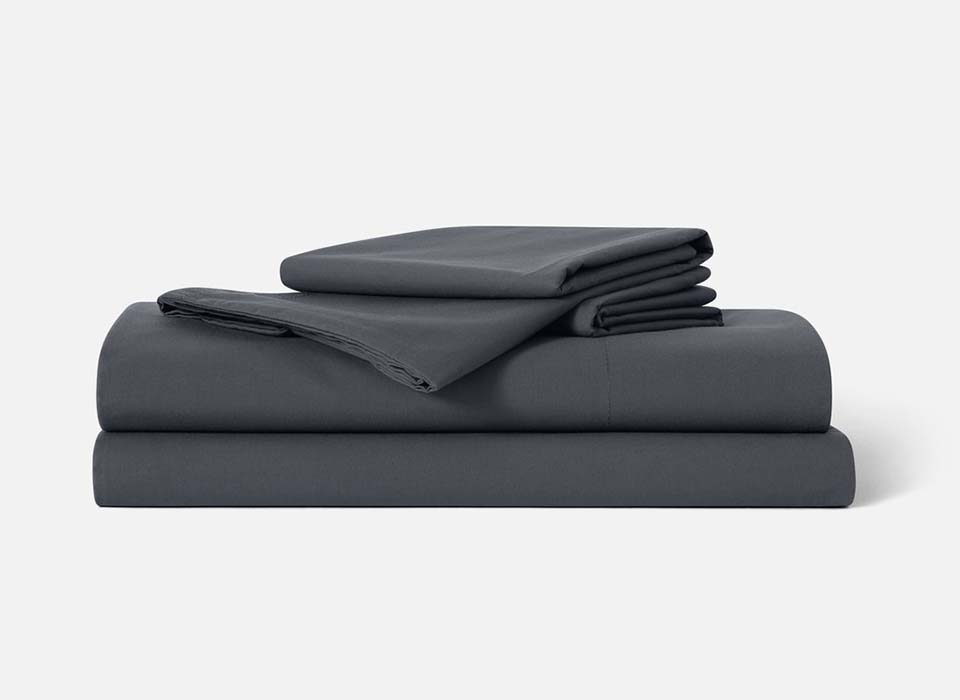 Stack of charcoal grey Brooklinen sheets