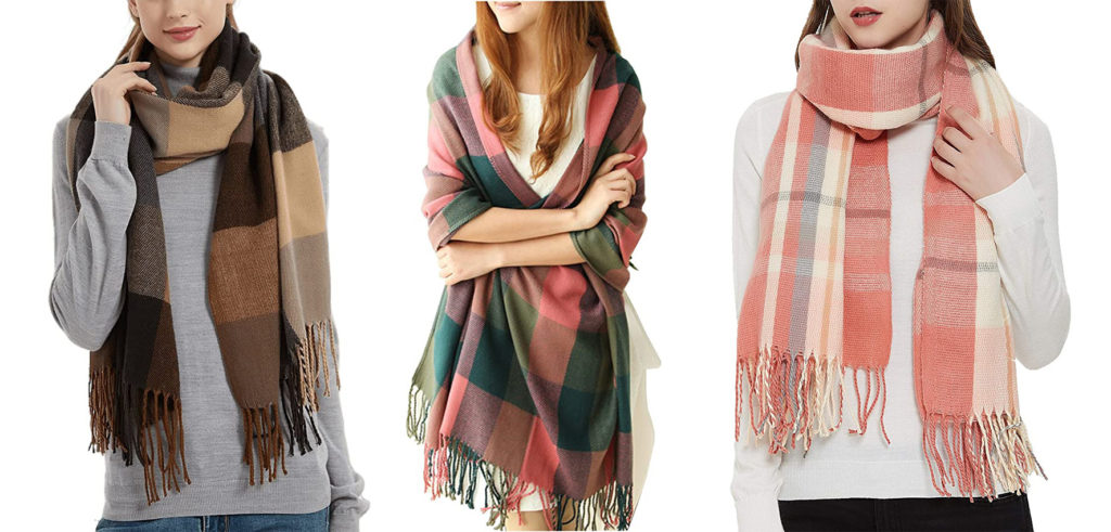 Three models wearing different colors of the Wander Agio Long Shawl