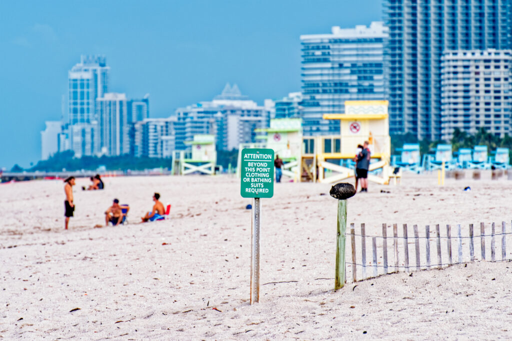 Sign indicating the line between the nudist portion and the clothed portion of Haulover Beach, Miami