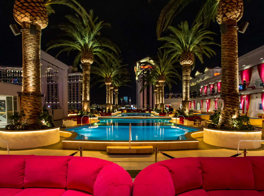 Pool surrounded by palm trees and lounge chairs at the Cromwell Las Vegas, Nevada, United States