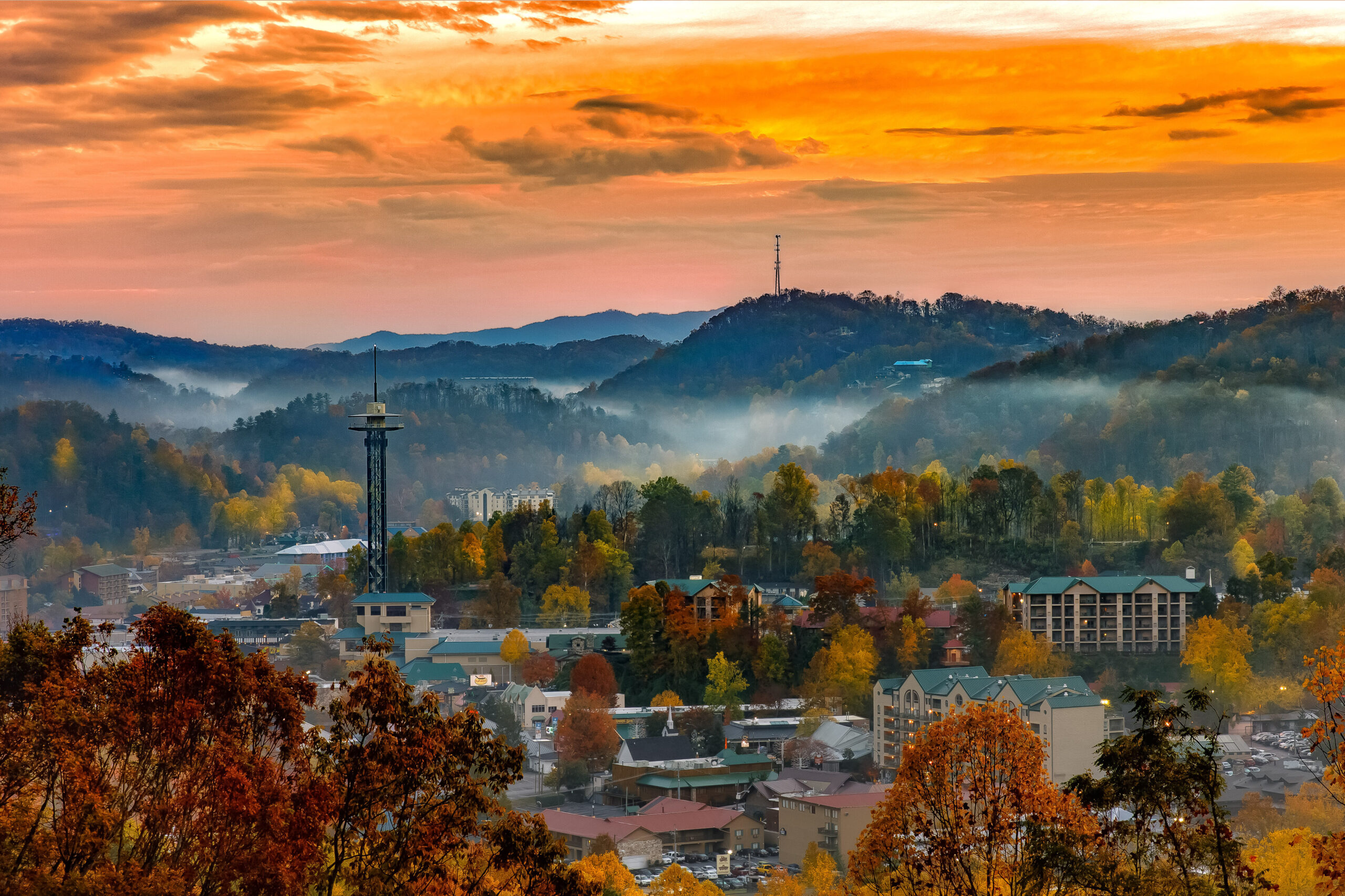 Gatlinburg, Tennessee in front of the Smoky Mountains at sunset