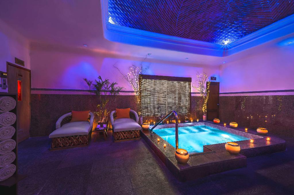 Indoor hot tub and lounge area at Desire Riviera Maya Pearl Resort