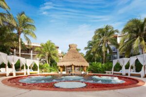 Outdoor lounge and pool area at Desire Riviera Maya Pearl Resort