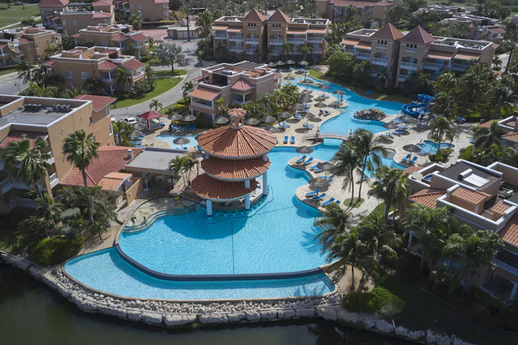 Aerial view of the Divi Village Golf & Beach Resort looking at the hotel buildings and the pool