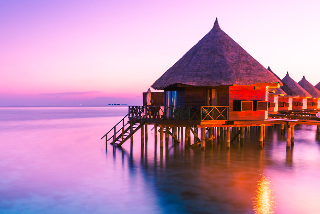 Water bungalow. Sunset on the islands of the Maldives. A place for dreams.