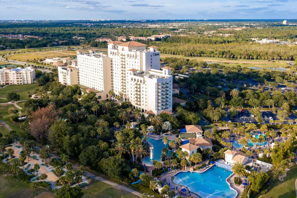 Aerial view of the Omni Orlando Resort at ChampionsGate showing multiple pools and the grounds of the property