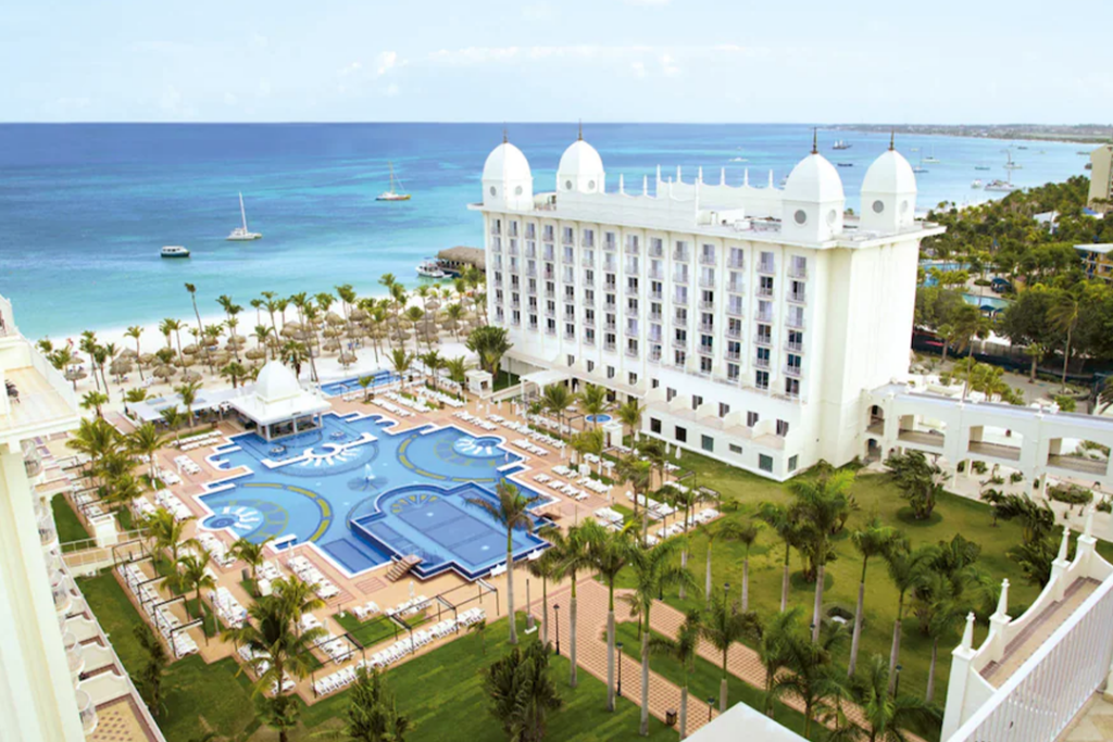Aerial view of the Riu Palace Aruba All Inclusive looking at the hotel, pool, beach, and ocean