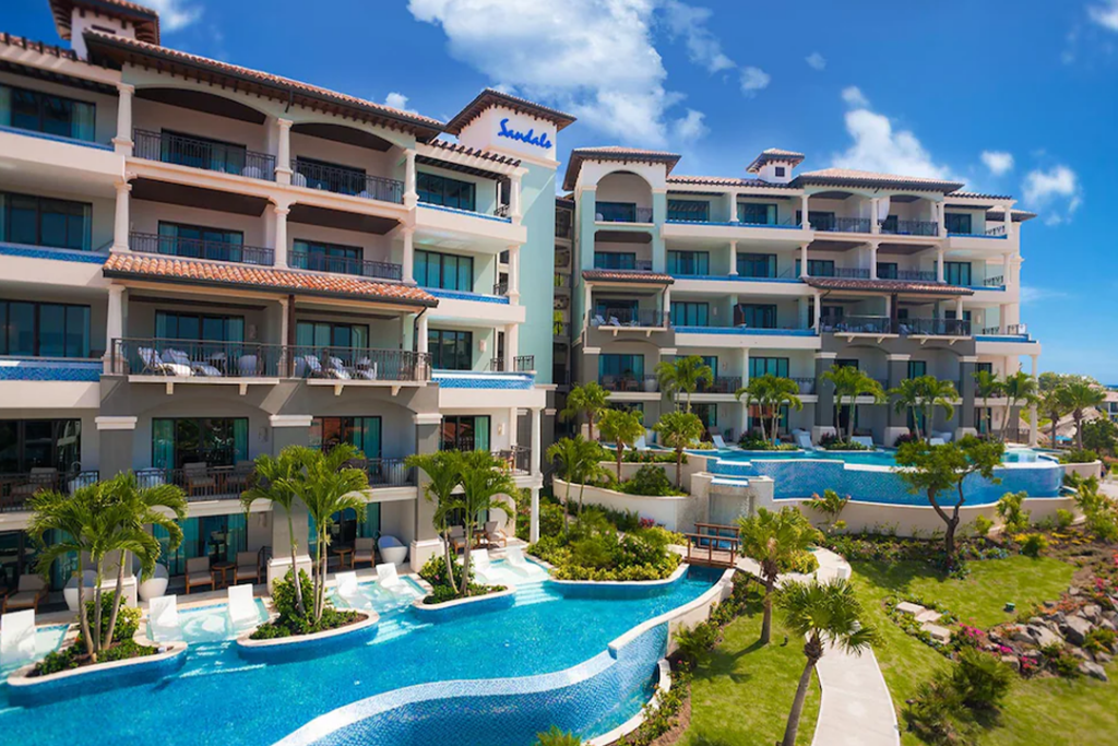 View of 2 builds at Sandals Grenada with balconies and pools