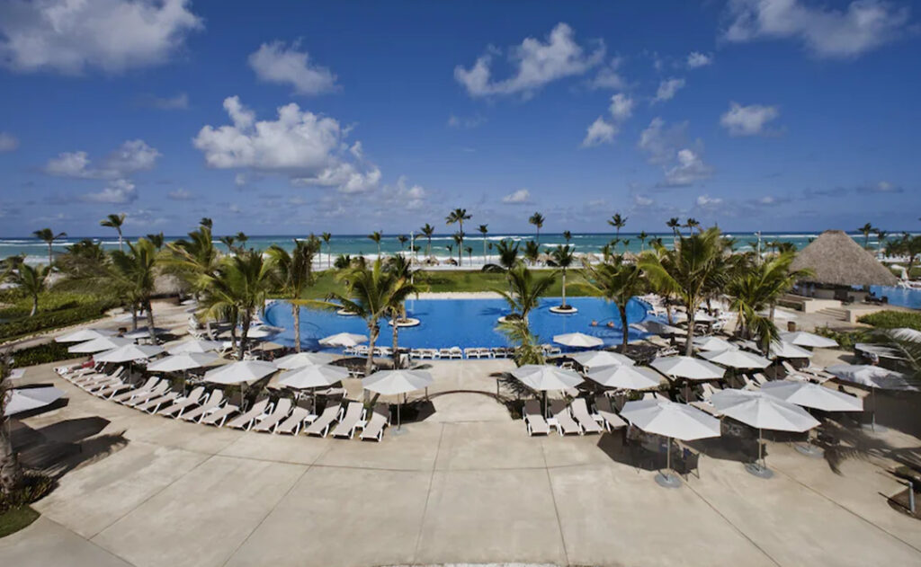 Pool at the Hard Rock Hotel & Casino Punta Cana with the beach in the distance