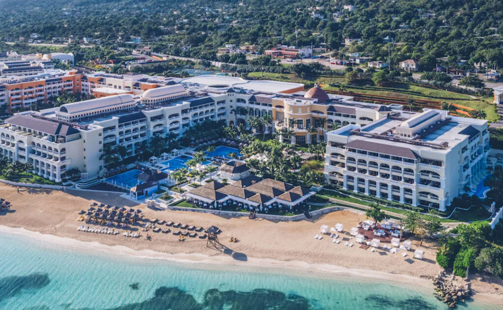 Aerial view of the Iberostar Grand Rose Hall from over the ocean