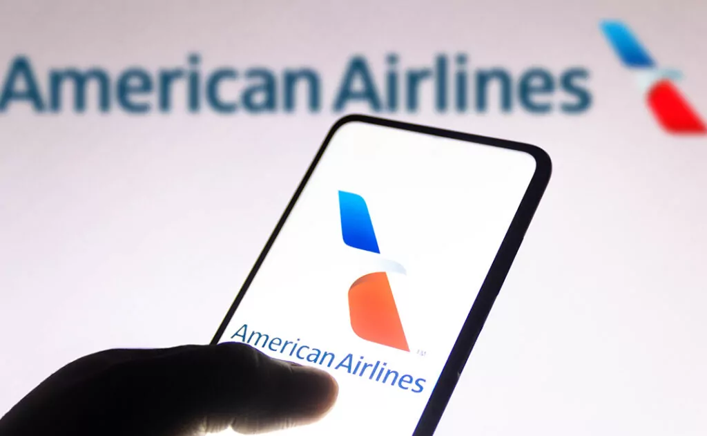 November 10, 2021, Brazil. In this photo illustration the American Airlines logo is seen displayed on a smartphone screen and in the background.
