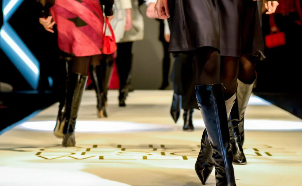 models are walking - female legs on a fashion show