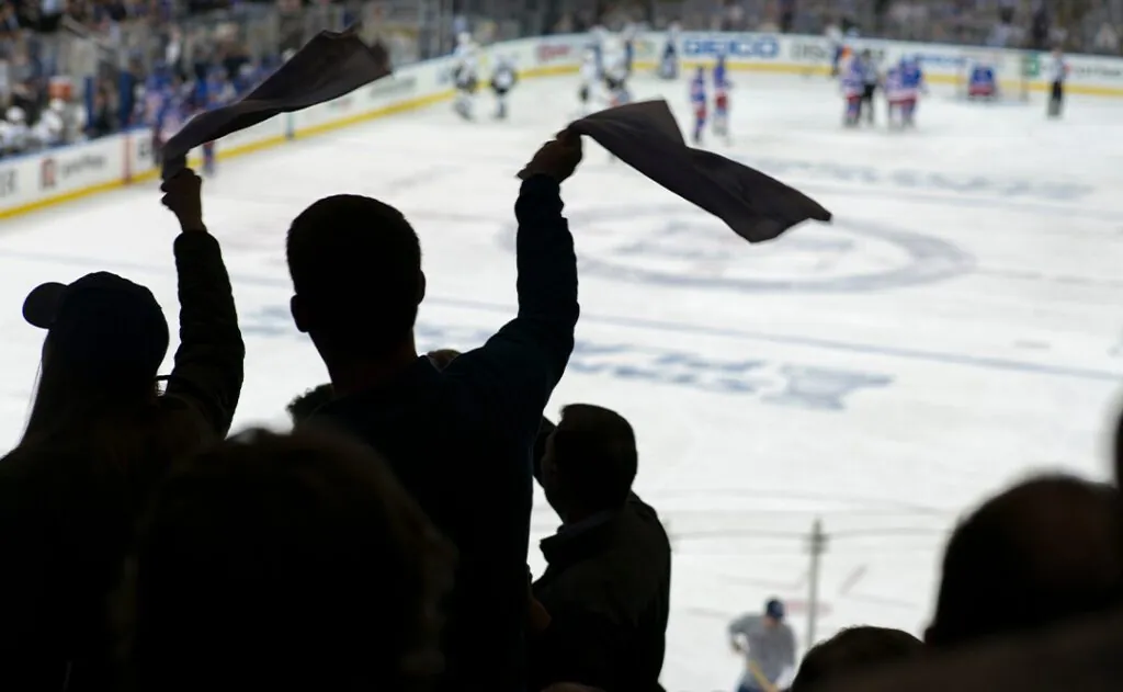 Cheering crowd at a hockey game, Madison Square Garden, Manhattan, New York City.