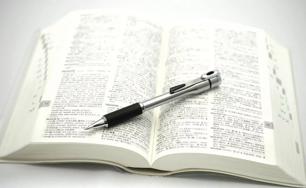 An English-Japanese dictionary and ball-point pen.