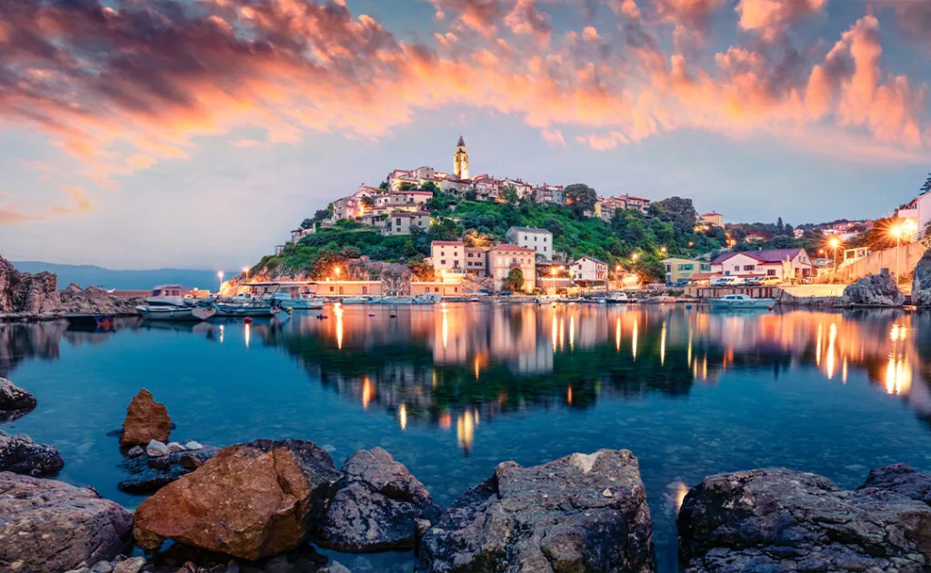 Breathtaking evening cityscape of Vrbnik town. Dramatic summer seascape of Adriatic sea, Krk island, Croatia, Europe.